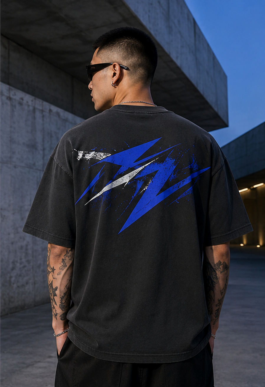 Back view showing the cobalt-and-white artwork on the Asphalt Echo oversized tee